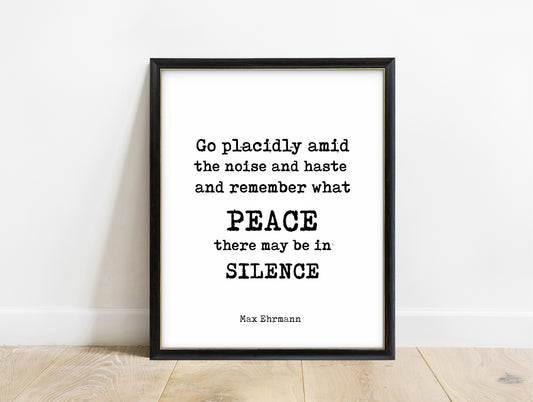 Max Ehrmann Desiderata go placidly peace and silence quote print in a black frame, white background
