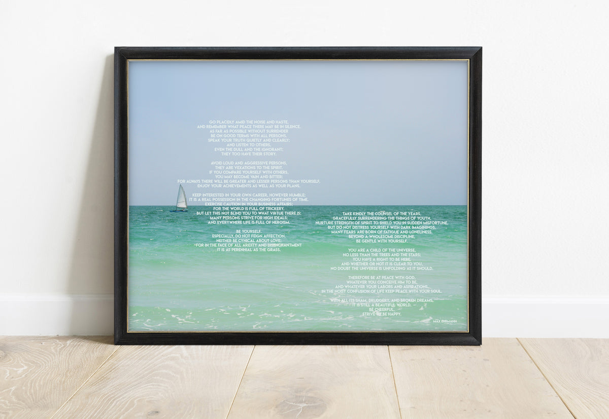 Max Ehrmann Desiderata poem print over a sea with a sailing boat, in a black frame