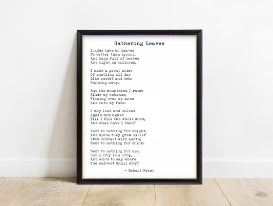 Robert Frost Gathering Leaves poem print in a black frame, white background