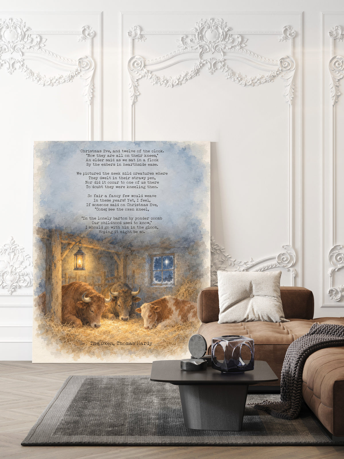 The Oxen full poem by Thomas Hardy above a watercolour candlelit barn with cattle in the straw on Christmas Eve, Christmas poem print shown unframed in a living room