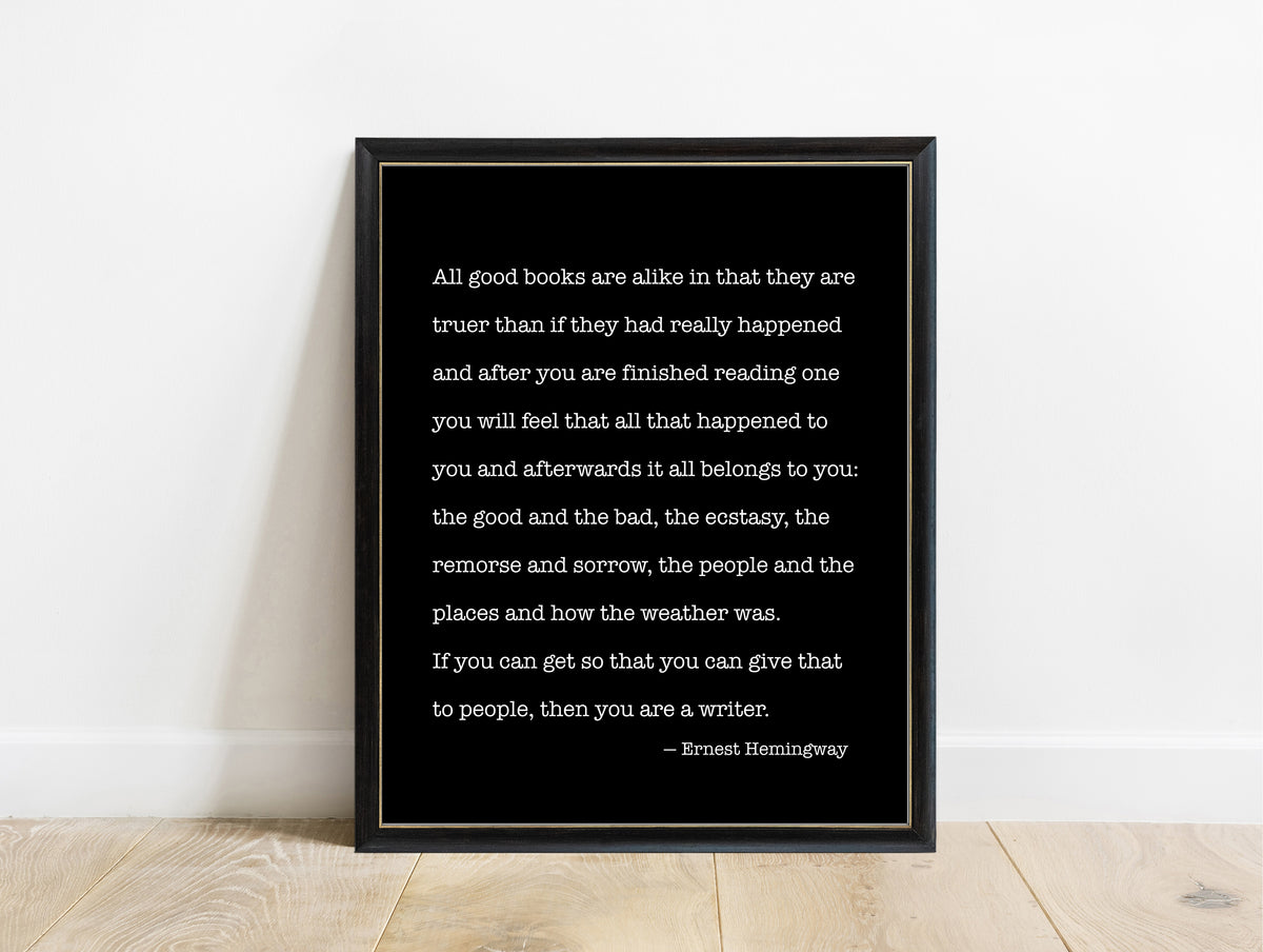 Ernest Hemingway all good books are alike quote print in a black frame, black background