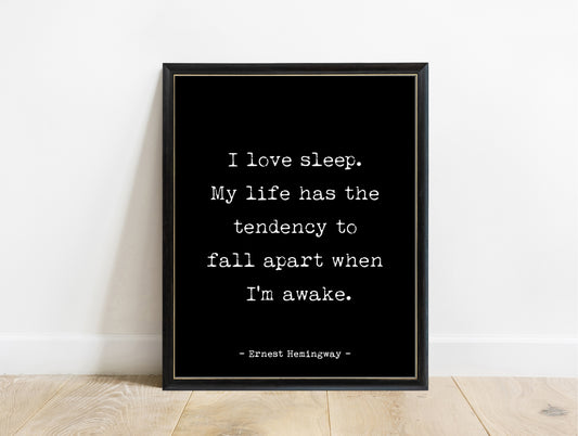 Ernest Hemingway I love sleep quote print in a black frame, black background