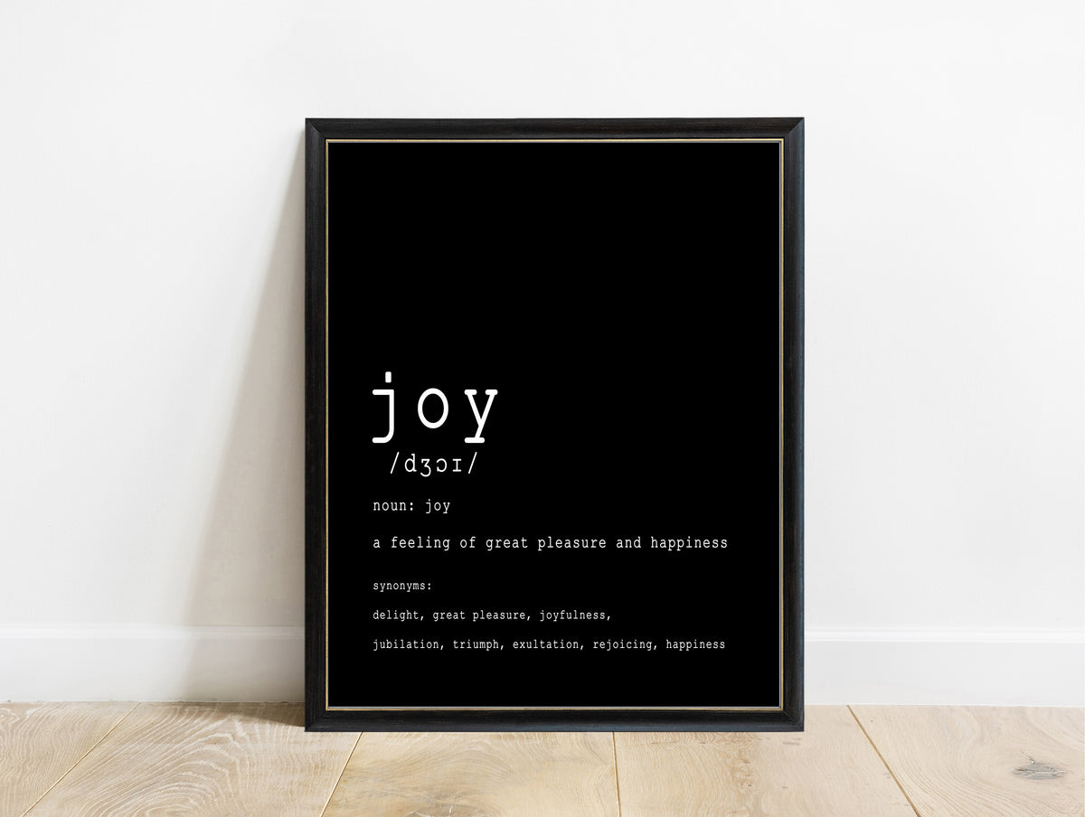 Joy definition dictionary print in a black frame, black background