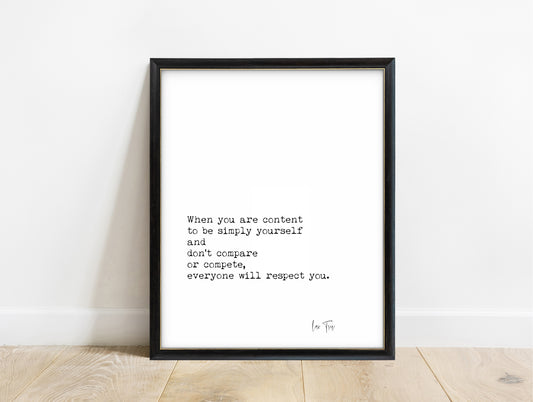Lao Tzu content to be simply yourself typewriter quote print in a black frame, white background
