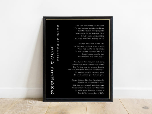 Douglas Malloch Good Timber poem print with vertical typewriter title in a black frame, black background