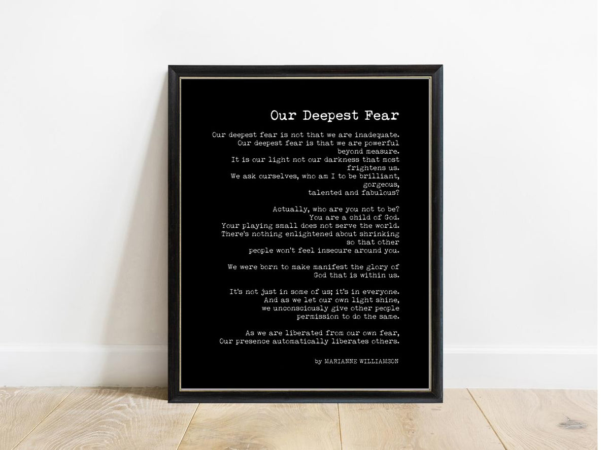 Marianne Williamson Our Deepest Fear book page print in a black frame, black background