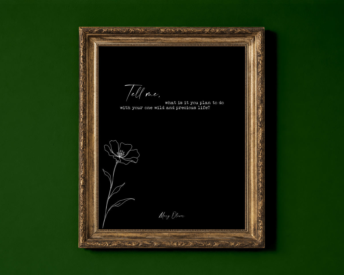 Mary Oliver Tell me, what is it you plan to do with your one wild and precious life quote print with a line art wildflower, black background, shown in a gold frame for display only; framed prints are sent in a black frame