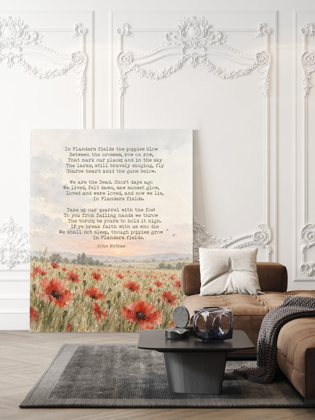 In Flanders Fields poem by John McCrae above a watercolour meadow of red poppies, remembrance poem print shown unframed in a living room
