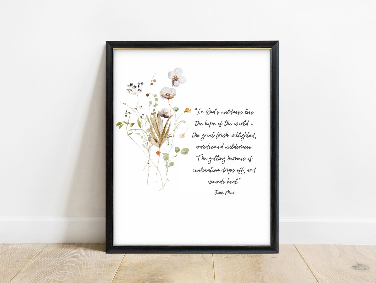 John Muir in God's wildness lies the hope of the world quote print with dried wildflowers, in a black frame