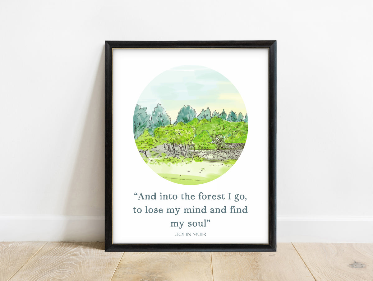 John Muir and into the forest I go quote print with a green watercolour forest circle, in a black frame