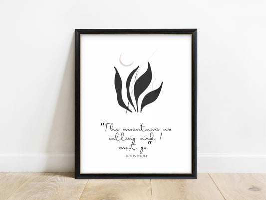 John Muir the mountains are calling and I must go quote print with black botanical leaves, in a black frame