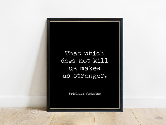 Friedrich Nietzsche that which does not kill us makes us stronger typewriter quote print in a black frame, black background