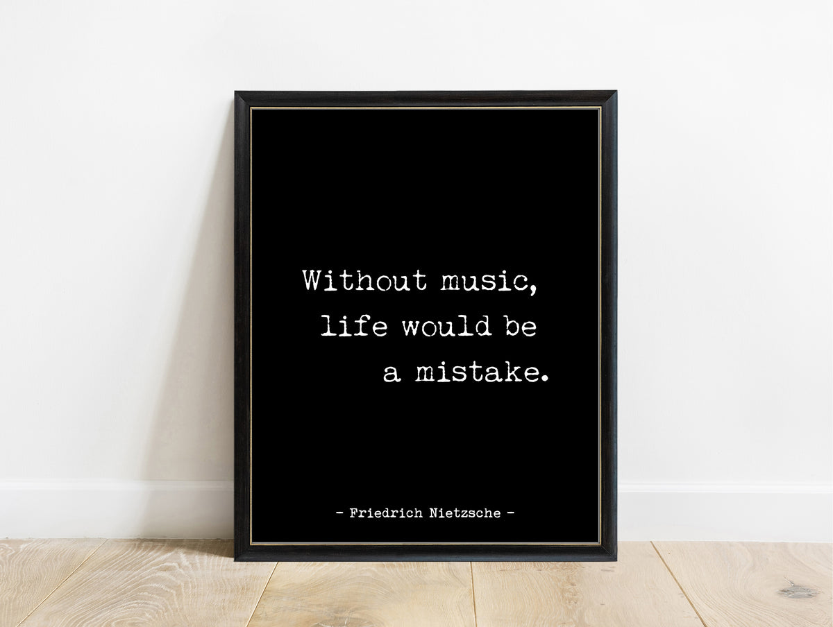 Friedrich Nietzsche without music life would be a mistake staggered typewriter quote print in a black frame, black background