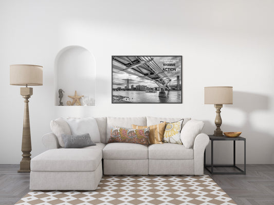 Tony Robbins massive determined action quote over a black and white photograph of the Millennium Bridge, London, shown framed in a living room