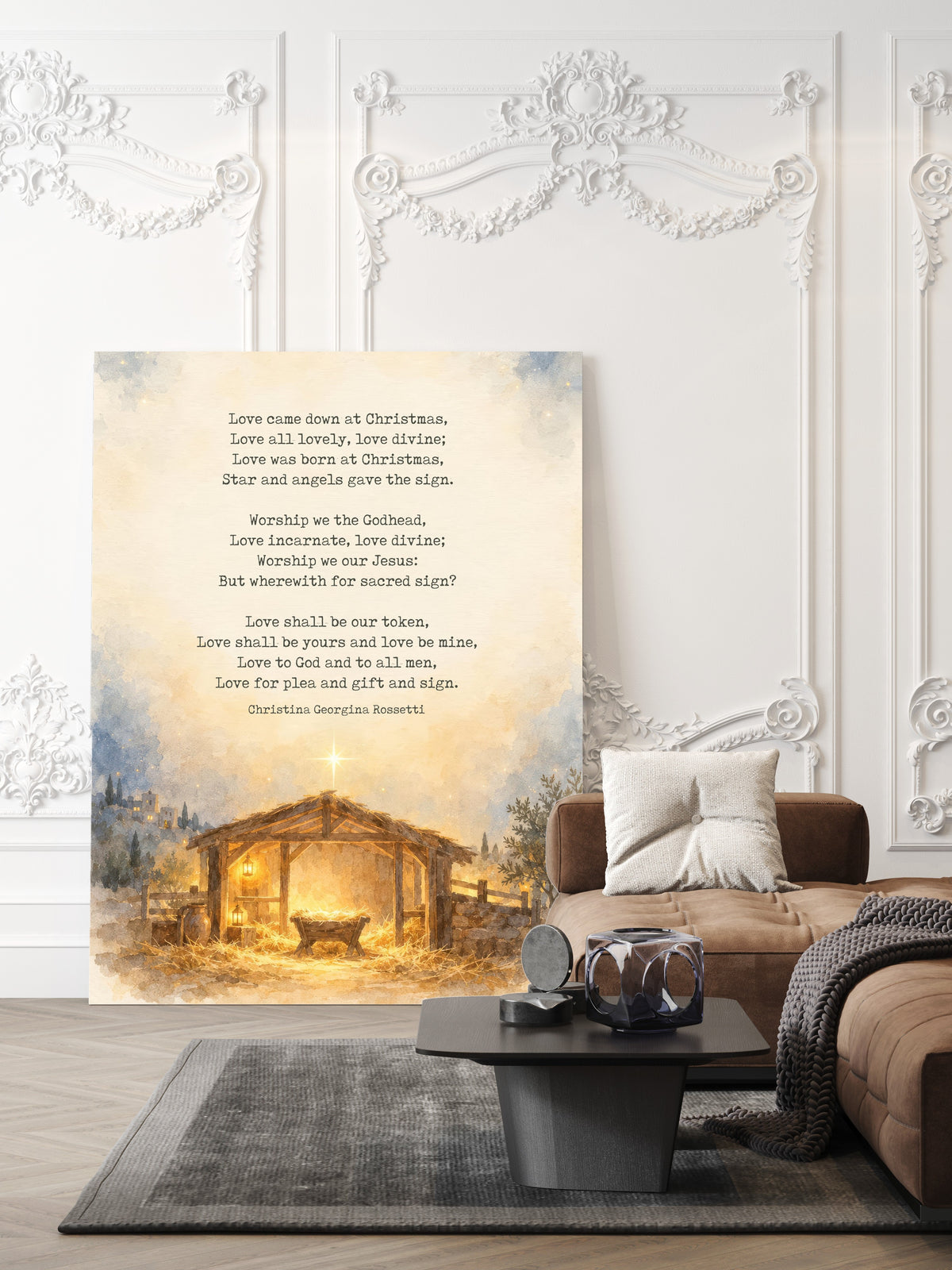Love Came Down at Christmas poem by Christina Rossetti above a watercolour nativity stable with star, Christmas print shown unframed in a living room