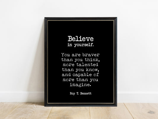 Roy T. Bennett believe in yourself, you are braver than you think typewriter quote print in a black frame, black background