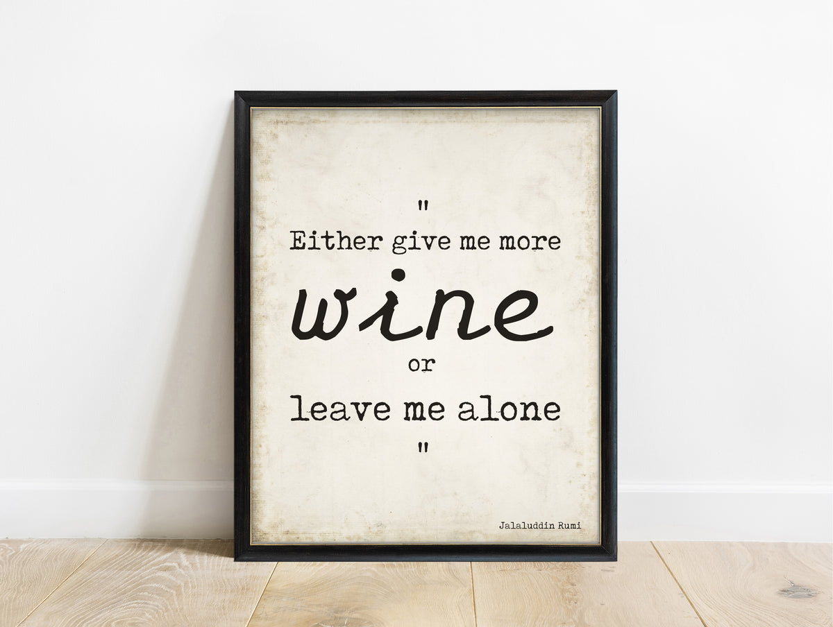 Rumi Either Give Me More Wine quote print in a black frame, vintage background