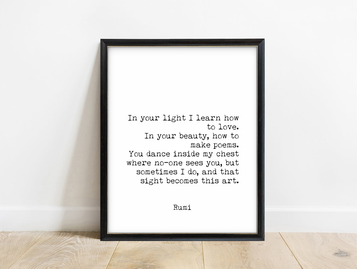Rumi In Your Light quote print in a black frame, white background