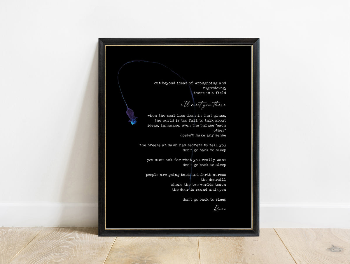 Rumi Out Beyond Ideas poem with a watercolour flower print in a black frame, black background
