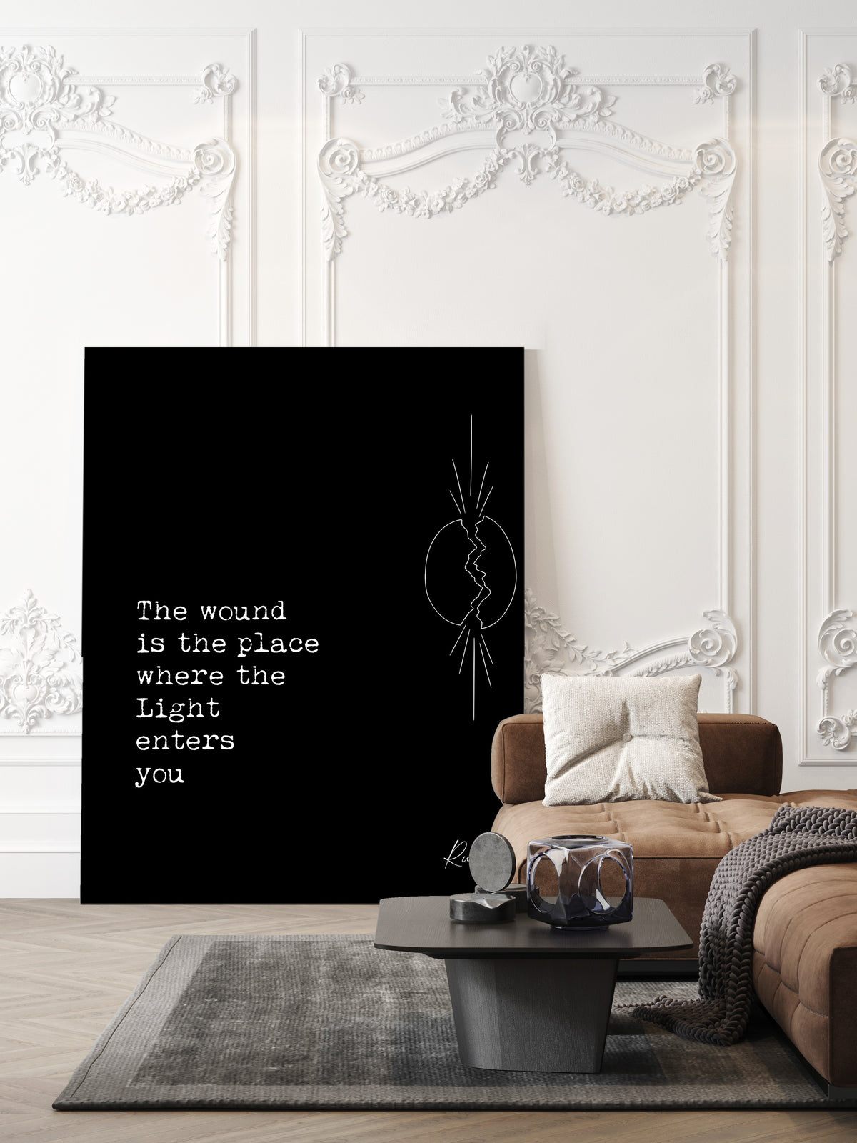 Rumi The wound is the place where the Light enters you quote print with a line art cracked oval and light breaking through, black background, shown unframed in a living room