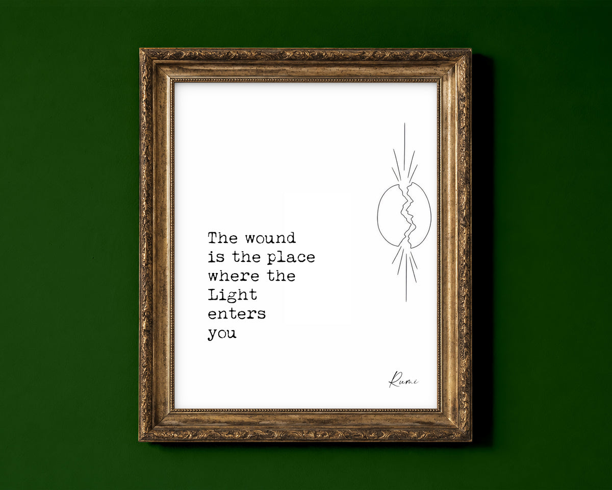 Rumi The wound is the place where the Light enters you quote print with a line art cracked oval and light breaking through, white background, shown in a gold frame for display only; framed prints are sent in a black frame