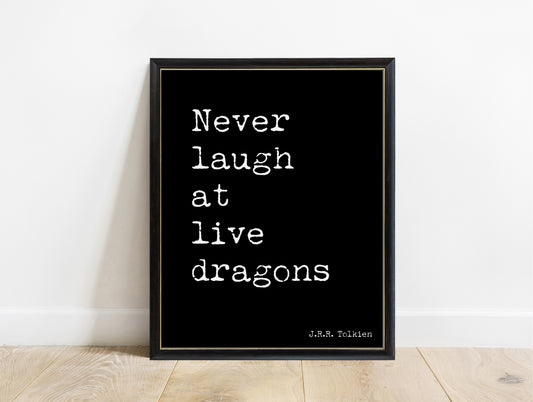 J.R.R. Tolkien never laugh at live dragons typewriter print in a black frame, black background