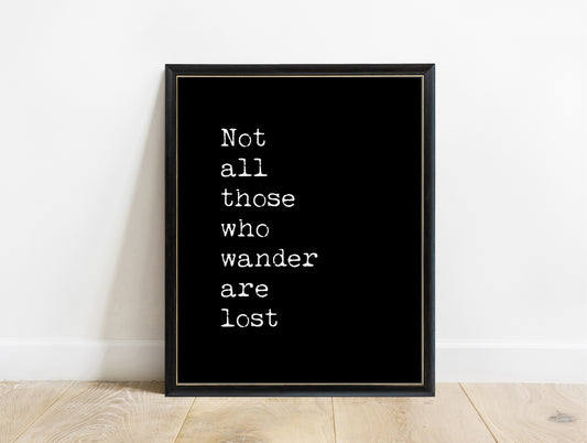 J.R.R. Tolkien not all those who wander are lost typewriter print in a black frame, black background