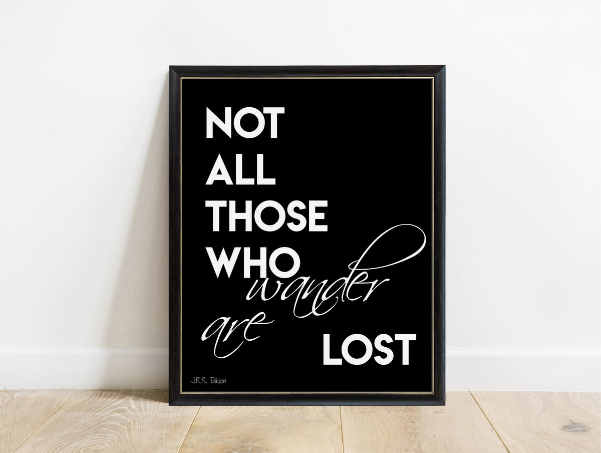J.R.R. Tolkien not all those who wander are lost bold script print in a black frame, black background