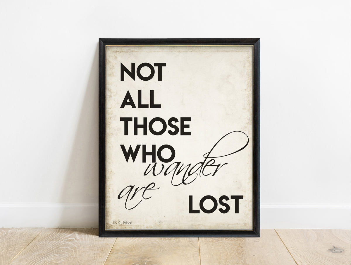 J.R.R. Tolkien not all those who wander are lost bold script print in a black frame, vintage background