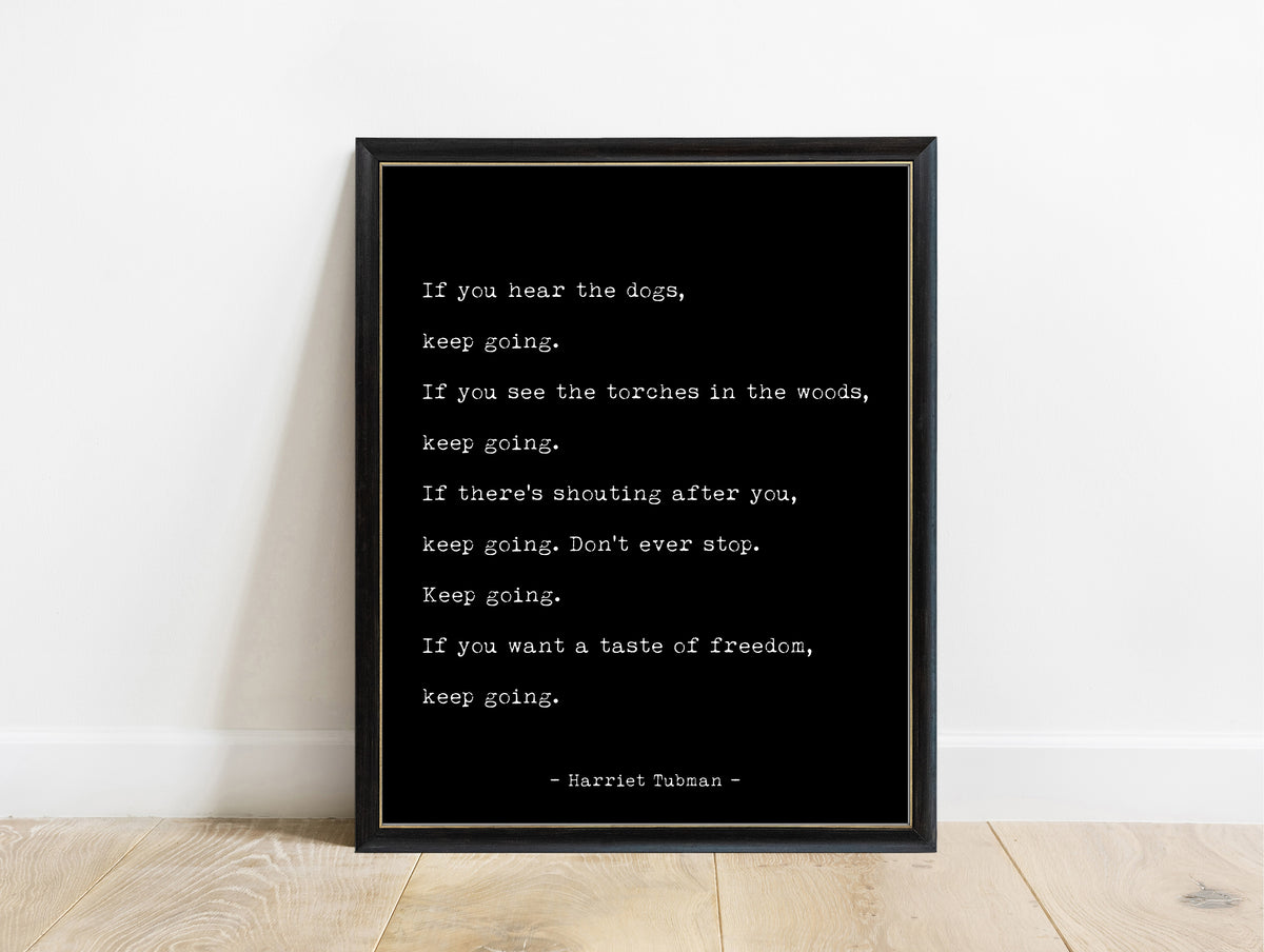 Harriet Tubman if you hear the dogs keep going typewriter quote print in a black frame, black background