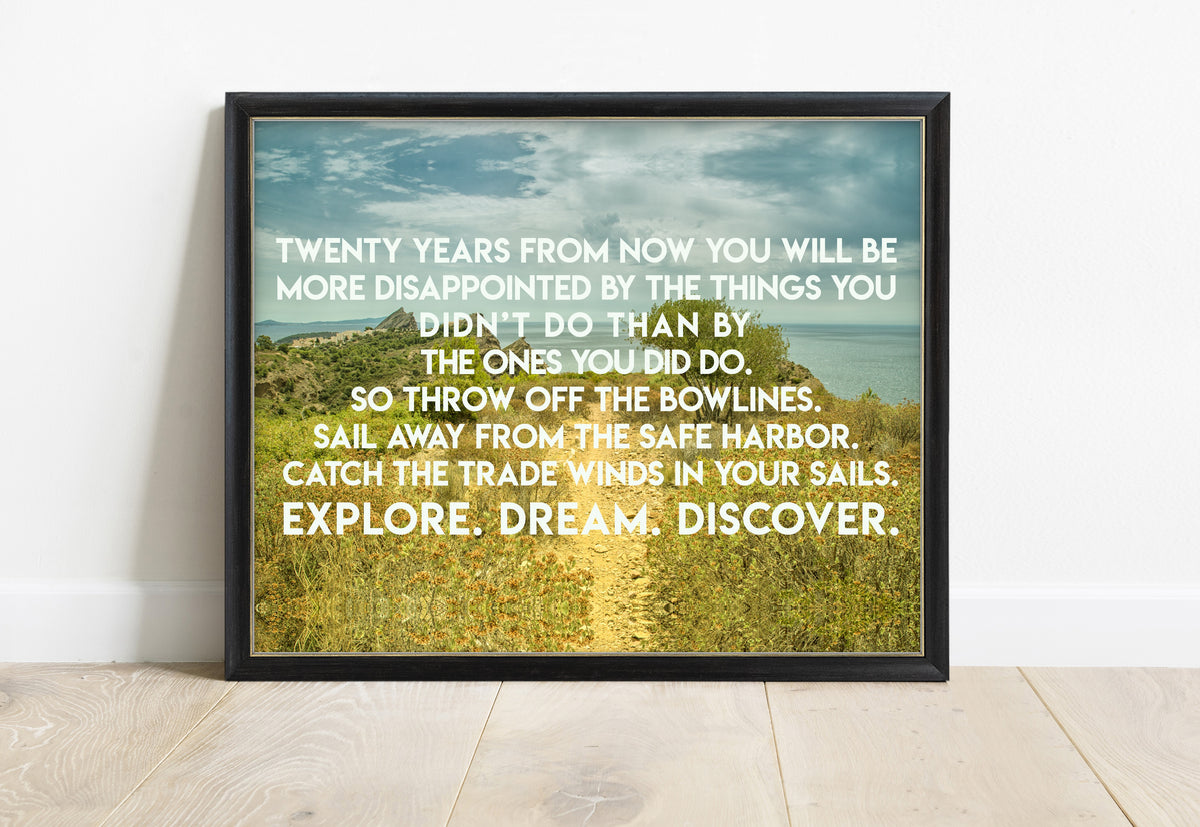Mark Twain explore, dream, discover quote over a coastal path photo, in a black frame