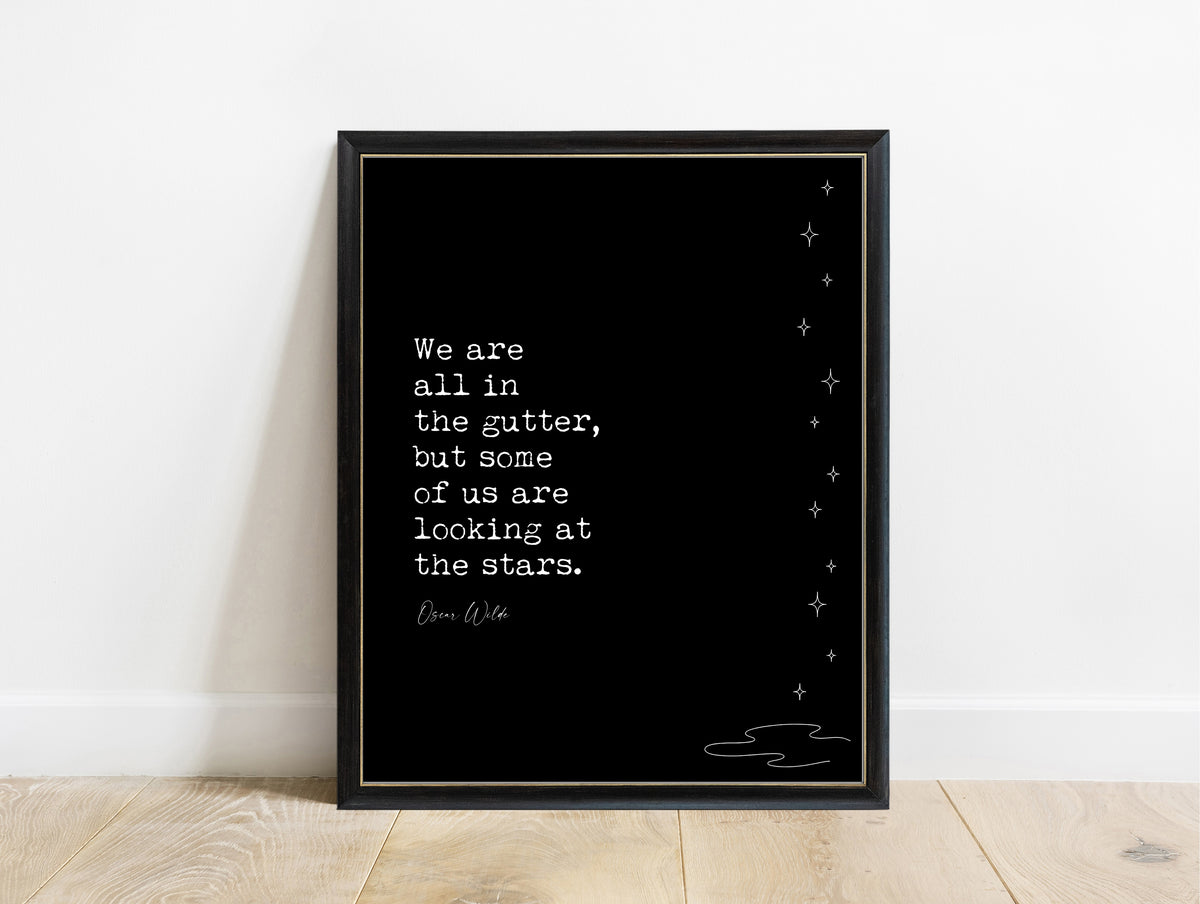 Oscar Wilde We are all in the gutter but some of us are looking at the stars quote print with line art stars, black background, in a black frame