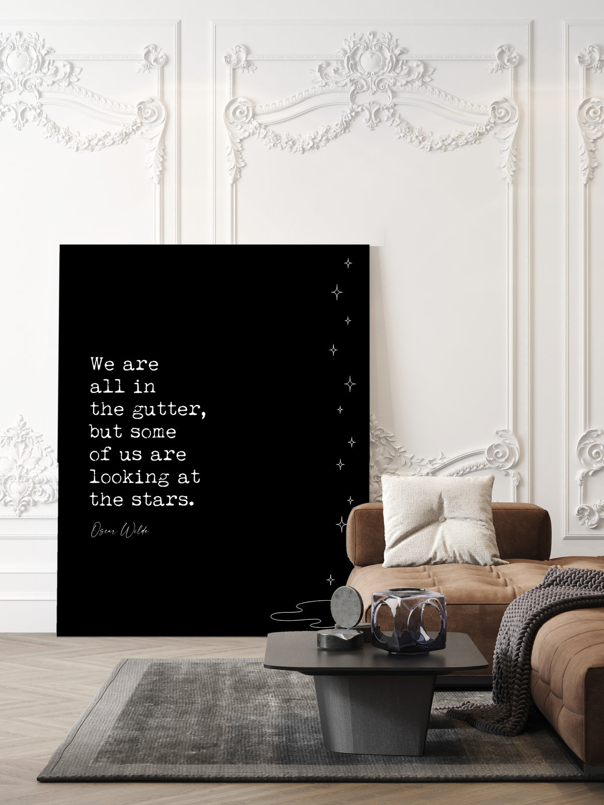 Oscar Wilde We are all in the gutter but some of us are looking at the stars quote print with line art stars, black background, shown unframed in a living room