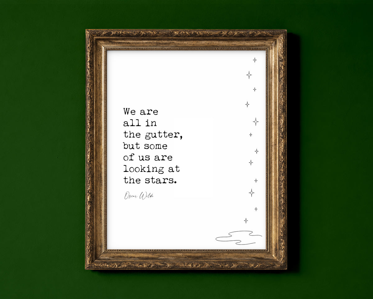 Oscar Wilde We are all in the gutter but some of us are looking at the stars quote print with line art stars, white background, shown in a gold frame for display only; framed prints are sent in a black frame