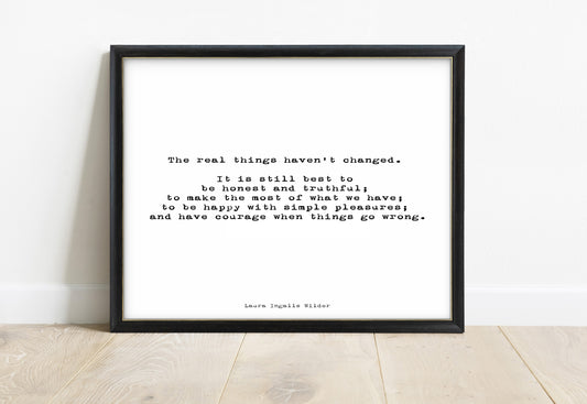 Laura Ingalls Wilder the real things haven't changed landscape typewriter quote print in a black frame, white background