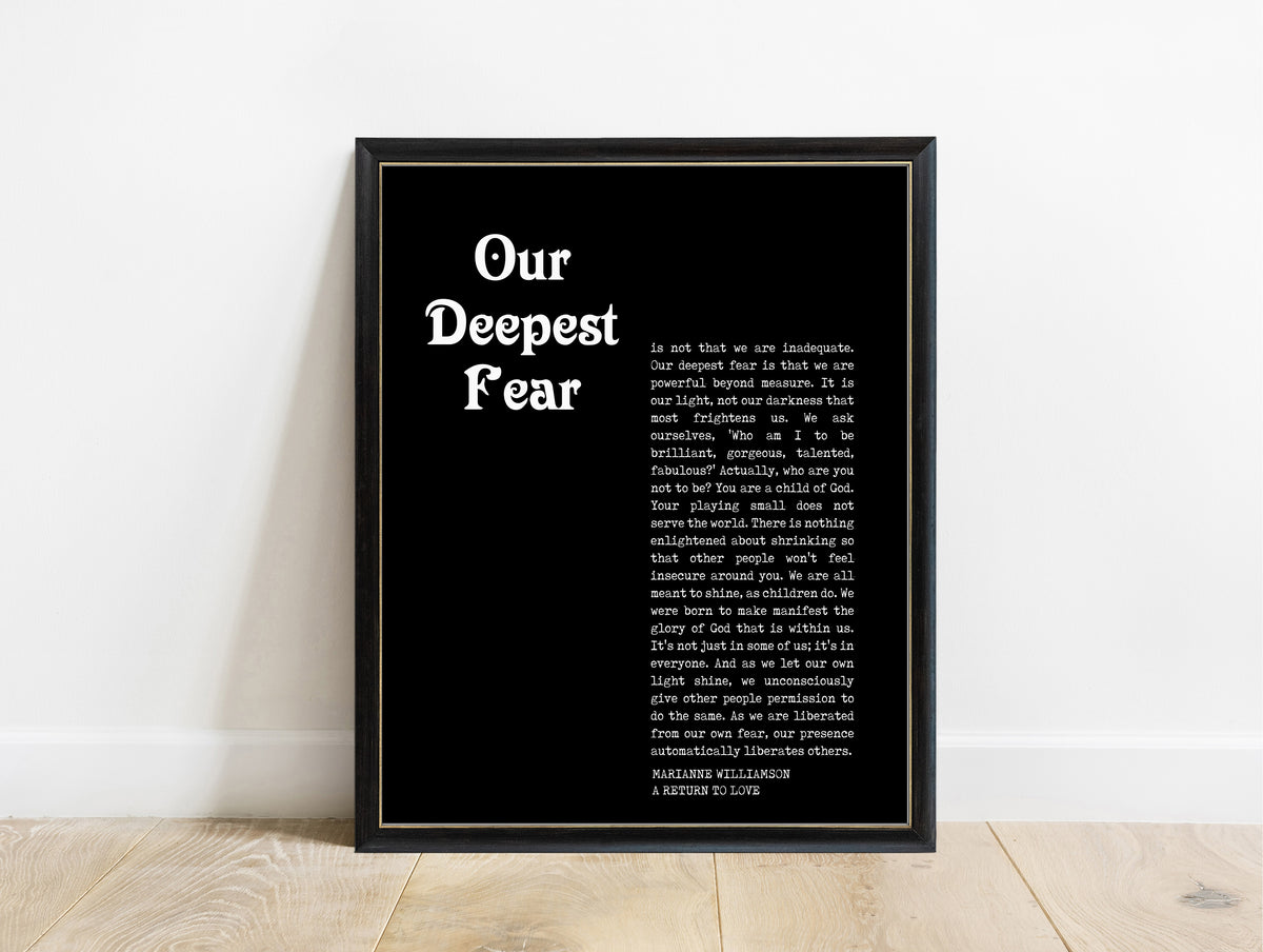Marianne Williamson our deepest fear magazine style quote print in a black frame, black background