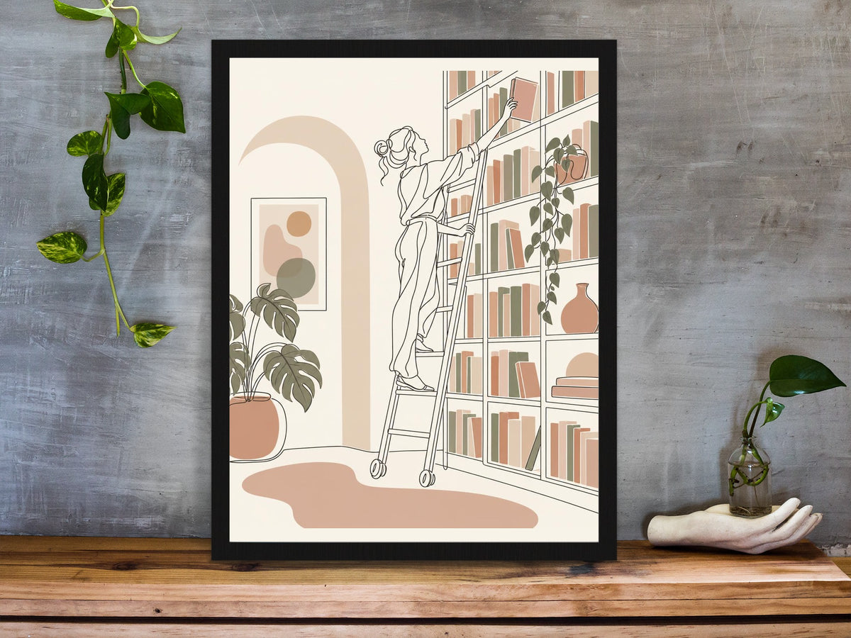 Woman on a library ladder reaching for a book, line art print framed on a desk