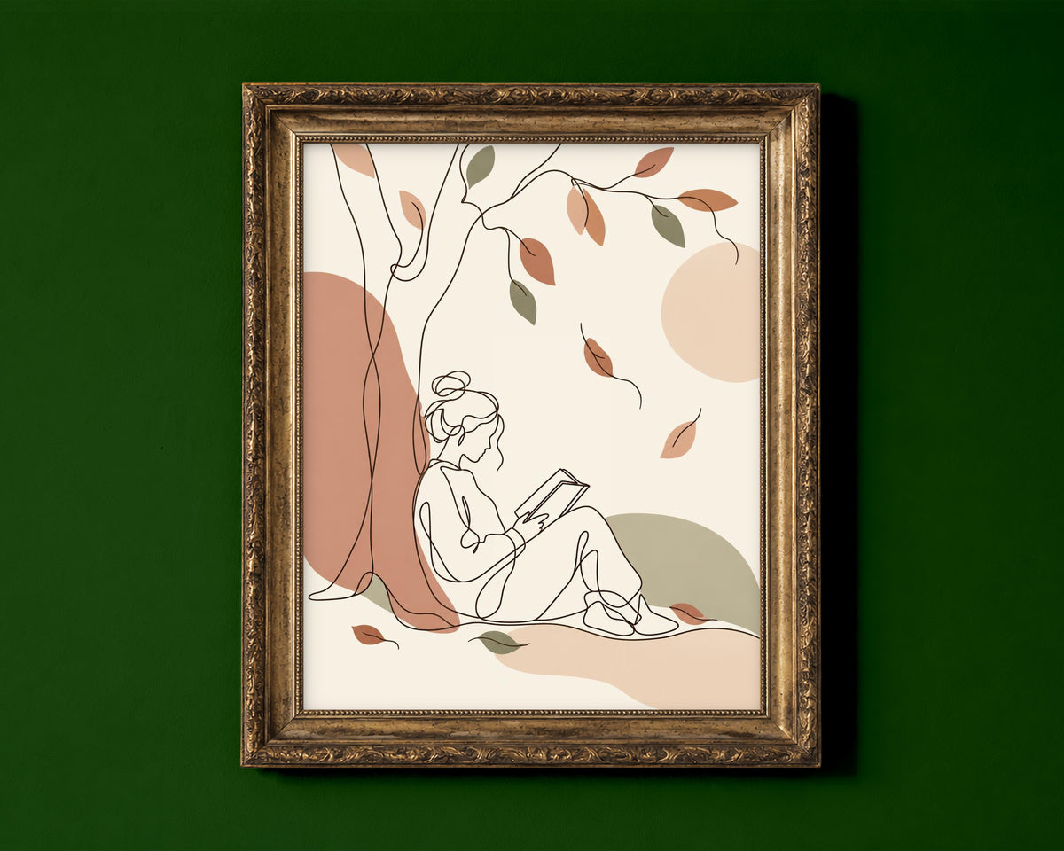 Line art of a woman reading under a tree with falling autumn leaves in boho colours shown in a gold frame for display only; framed prints are sent in a black frame