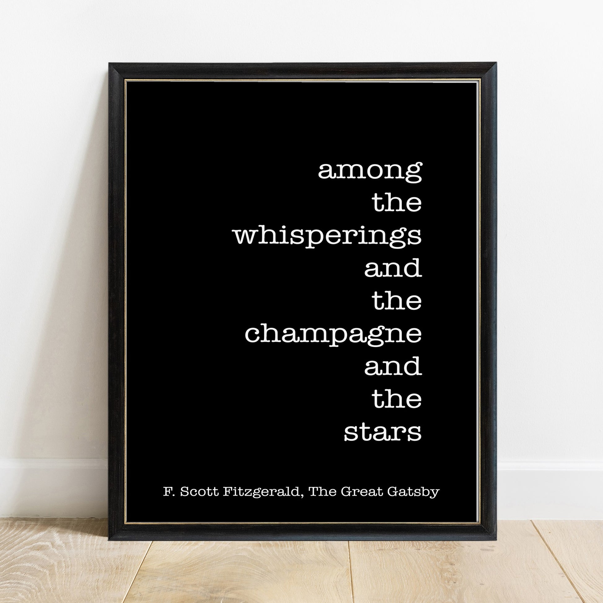 F Scott Fitzgerald among the whisperings and the champagne and the stars print in a black frame, black background