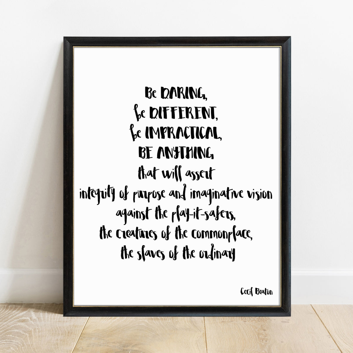 Cecil Beaton be daring be different quote print in a black frame, white background