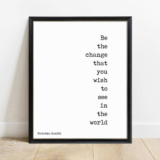 Be the change Mahatma Gandhi quote print in a black frame, white background