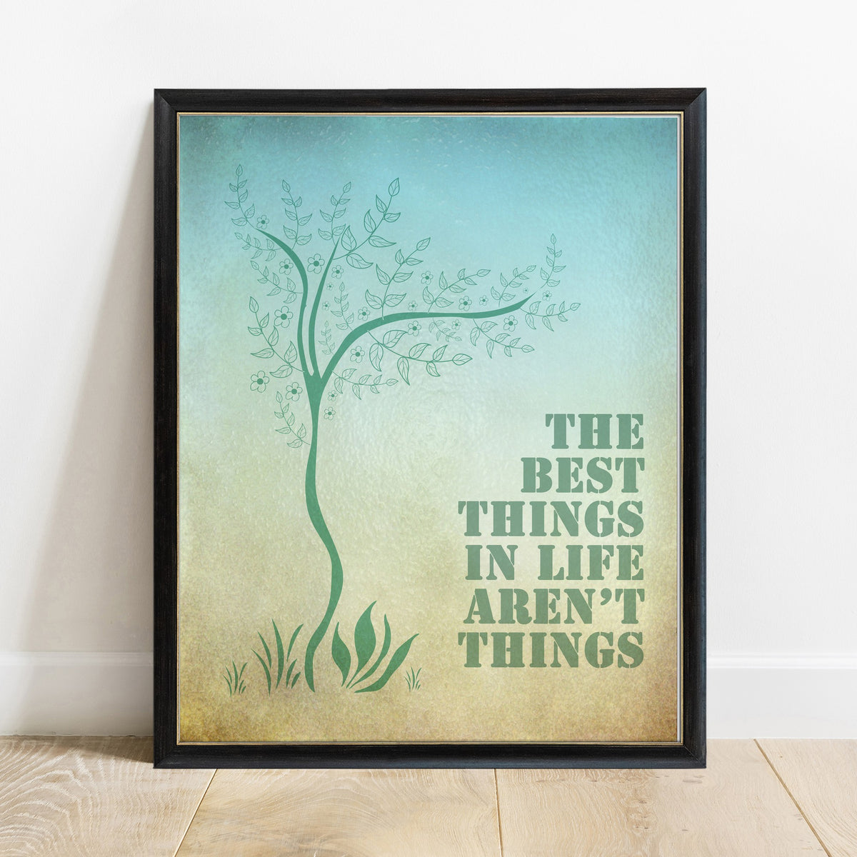 The best things in life aren't things Art Buchwald watercolour tree print in a black frame, white background