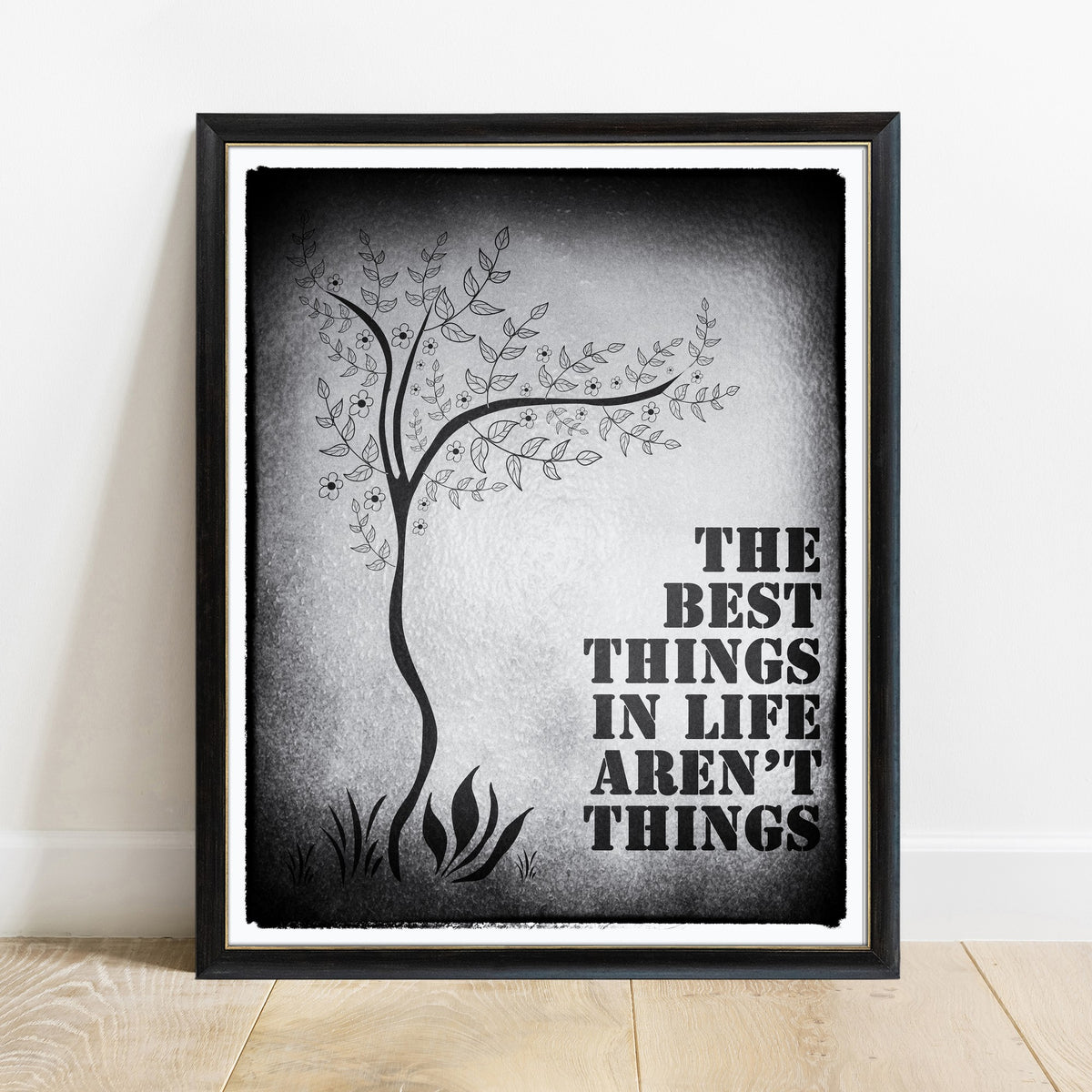 The best things in life aren't things Art Buchwald watercolour tree print in a black frame, black background