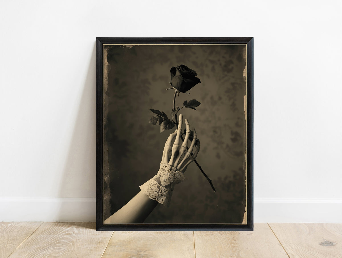 Skeleton hand in a lace cuff holding a black rose, sepia Victorian gothic dark academia print in a black frame