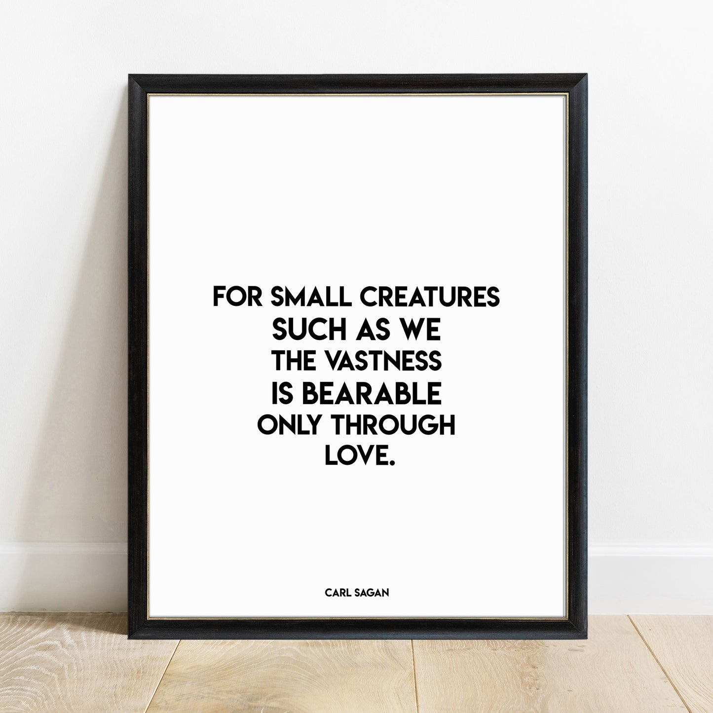 Carl Sagan vastness is bearable through love quote print in a black frame