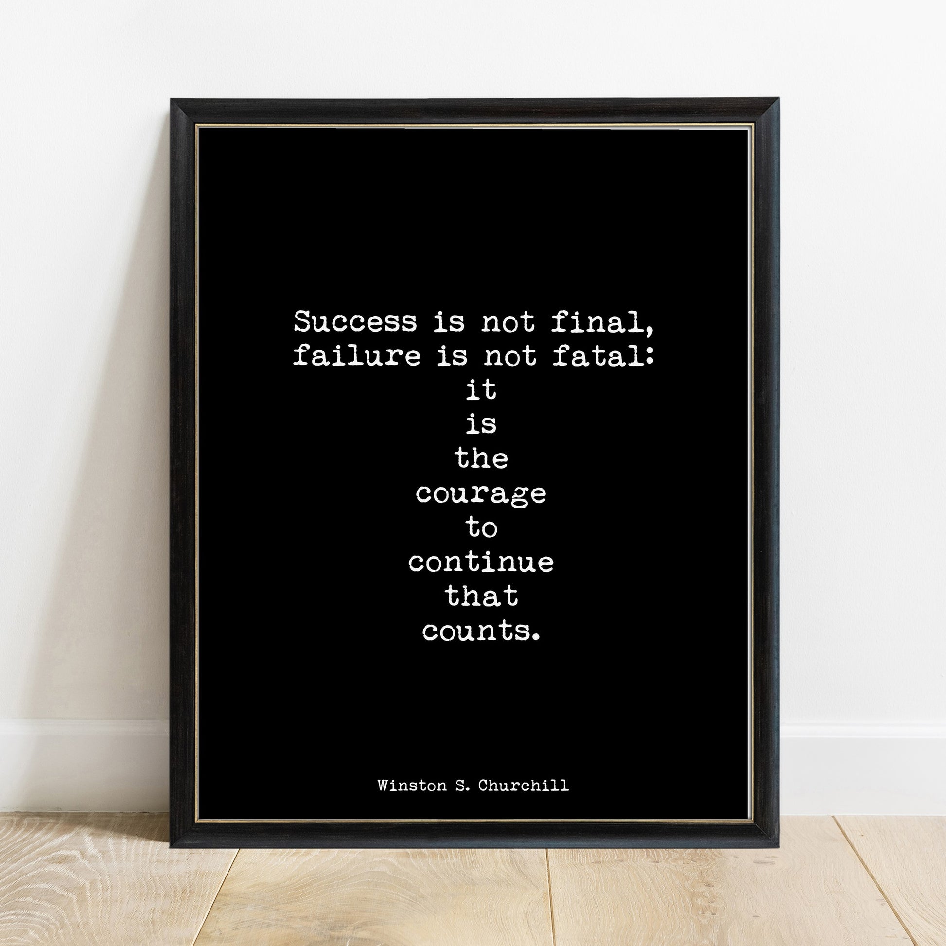 Winston Churchill courage to continue quote print in a black frame, black background