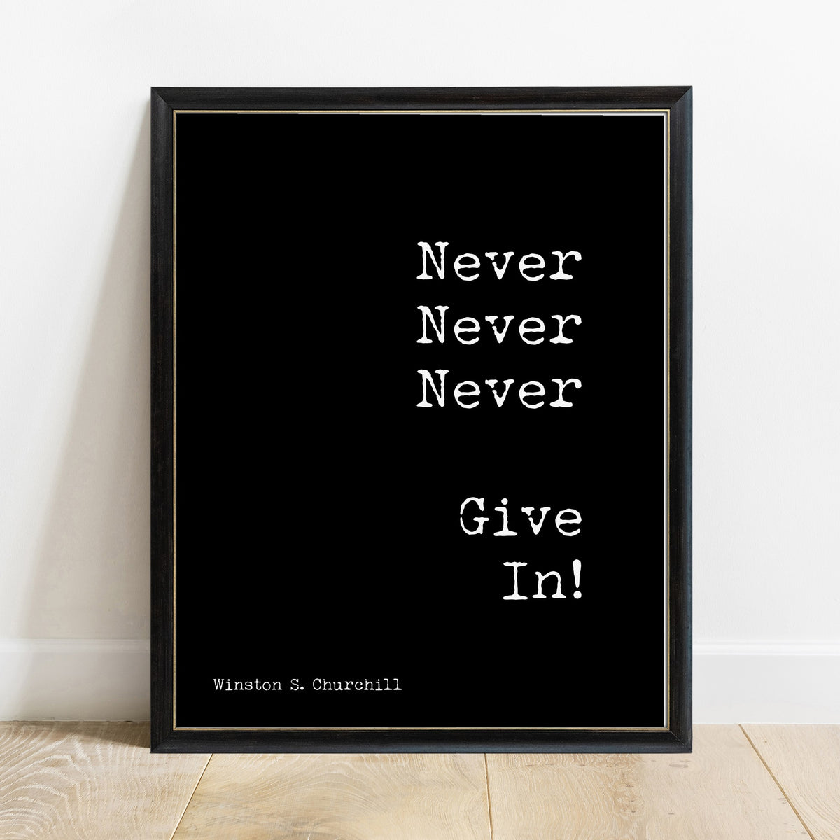 Winston Churchill never give in quote print in a black frame, black background