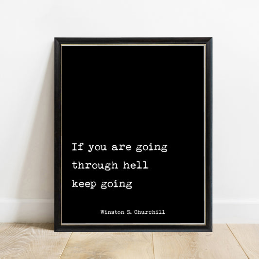 Winston Churchill If You Are Going Through Hell print in a black frame, black background