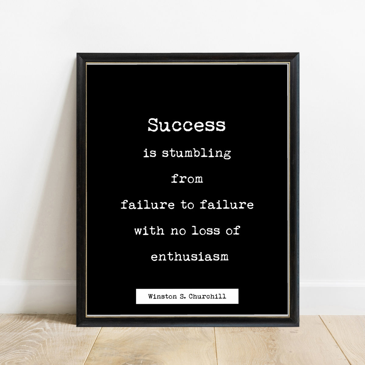 Winston Churchill Success Is Stumbling print in a black frame, black background