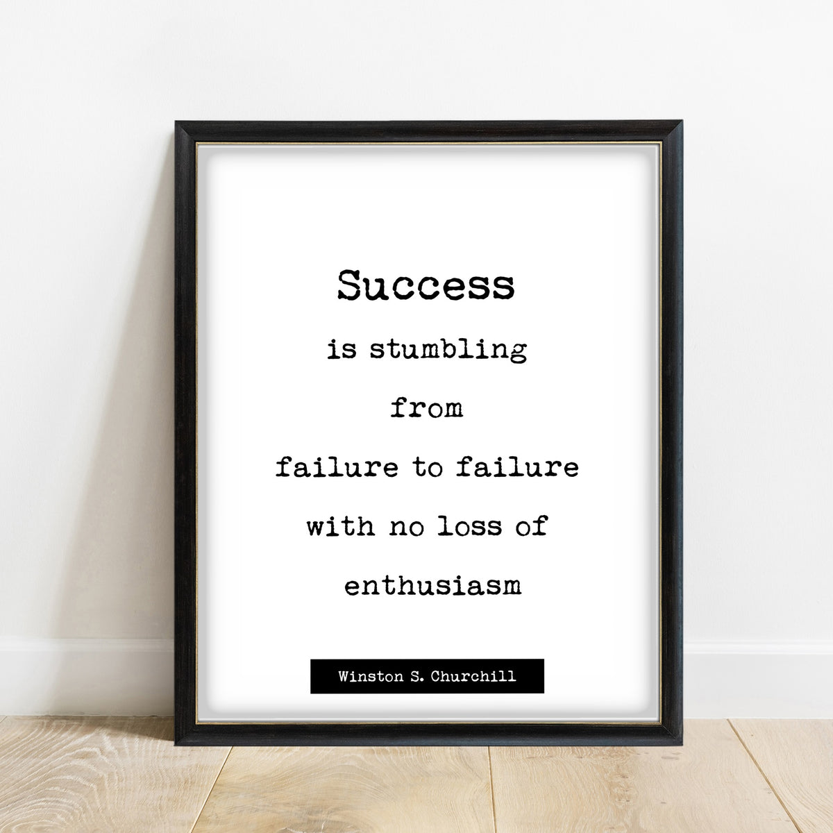 Winston Churchill Success Is Stumbling print in a black frame, white background